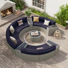 an outdoor fire pit surrounded by furniture