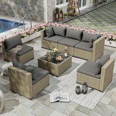 an outdoor patio furniture set with grey cushions