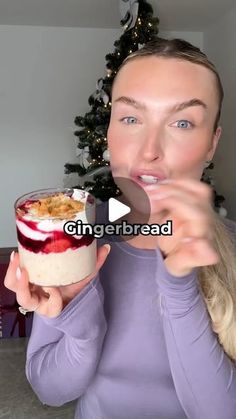 a woman eating a bowl of food while holding a spoon in her hand with the words gingerbread on it