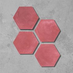 three pink hexagonal tiles arranged on top of each other