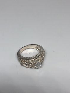 Vintage white sapphire ring Pave set 925 Sterling Silver Setting Size 8 Can be resized, my jeweler charges $10-$20 All rings are shipped free in the US in a nice gift box. Check out our over a THOUSAND great reviews Engraving is $4 per letter and is not always perfect depending on the piece. It can take a few days if the jeweler is busy. This is payable to Paypal Judithsltd@gmail.com Classic Silver Cubic Zirconia Rings, Classic Crystal Ring With Diamond Accents In White Topaz, Classic White Topaz Crystal Ring With Diamond Accents, Classic Ring With Vs Clarity, Silver Dazzling Wedding Jewelry, Classic White Crystal Ring With Vvs Clarity, Classic Silver Jewelry With Diamond Accents, Silver Fine Jewelry With Center Stone For Wedding, Classic Silver Crystal Ring With Diamond Cut