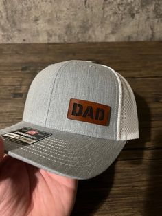 A gift any dad would love. Showing off his dad pride any chance he gets with his new custom dad hat.  Our hats are made with real leather patches and the highest quality hats. They can also be customized, just send us a message if you want to make any changes or personalize this hat for your dad. Cheap Customizable Hats For Father's Day, Girl Dad Hat, Leather Patch Hat, New Dad Gift, Patch Hat, Girl Dad, Dad Gifts, Gifts For New Dads, Quality Hats