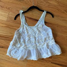 Free People New With Tags Embroidered Ivory Lace Top Size Small Embroidered Off White Summer Tops, Casual Embroidered Off White Tops, Off White Embroidered Summer Tops, Casual Cream Embroidered Top For Spring, Summer Off White Top With Floral Embroidery, Summer Embellished Embroidered Top, Cream Embroidered Tops For Vacation, Casual Cream Cotton Embroidered Top, Off White Floral Embroidered Top For Summer