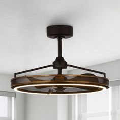 a light fixture in a room with windows