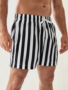 Our Striped Pattern Drawstring Waist Swim Shorts are perfect for stylish summer wear. Featuring a stylish striped pattern, these shorts offer a fashionable and lively look. An adjustable drawstring waist ensures a snug and secure fit, providing you with distraction-free comfort while swimming. Details: Pattern Type: Striped Details: Drawstring, Pocket Type: Bottoms Bottom Type: Shorts Fabric: Slight Stretch Composition: 100% Polyester Care Instructions: Machine wash, do not dry clean, wash with Trendy Striped Shorts With Built-in Shorts, Striped Cotton Swim Trunks For Beach, Trendy Striped Bottoms For The Beach, Trendy Striped Bottoms For Beach Season, Striped Cotton Swim Trunks For Beach Season, Striped Cotton Shorts With Drawstring, Striped Cotton Swim Trunks For Summer, Short Bottoms With Vertical Stripes For Vacation, Casual Striped Shorts With Drawstring