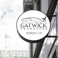 the sign for gatwick transferers is hanging from the side of a building