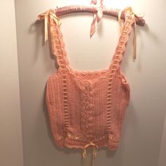 Award Winning Handcrafted Peach Orange Crochet Camisole / Tank Top With Ribbon Berribone Trim And Vintage Moonglow Lucite Buttons. Ribbons Make It Easy To Adjust The Fit At The Waist As Well As Vertically . Made Of Acrylic Luster Sheen Yarn , Easy Care. Hand Wash Or Machine Wash On Delicate. 14" Pit To Pit But It Is Stretchy. Pair It With A Flowy Skirt For An Afternoon Summer Picnic Or Garden Party ! This Is One Of The Favorite Things I Have Made. Handmade - Crocheted By Me! Aj Nelly Peach Fuzz Feminine Sleeveless Crochet Top With Crochet Trim, Feminine Fitted Crochet Top With Crochet Trim, Fitted Cotton Crochet Camisole Top, Spring Peach Sleeveless Crop Top, Fitted Feminine Crochet Top With Crochet Trim, Fitted Crochet Lace Cami Tank Top, Peach Sleeveless Crop Top For Spring, Sleeveless Peach Crop Top For Spring, Fitted Crochet Lace Cami Crop Top