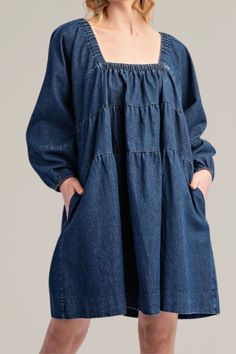 this classic, tiered denim long sleeve dress is crafted from soft, high-quality cotton. it features a flattering square neckline and long sleeves with gathered cuffs for a relaxed yet timeless look. the tiered design adds a playful touch, creating a flowy silhouette that's perfect for any occasion. with practical side pockets, this dress combines comfort and fashion seamlessly. dress it up with statement jewelry or keep it casual with your favorite sneakers for a versatile wardrobe staple. 100% Versatile Wardrobe, Romper With Skirt, Dress Romper, Hat Hairstyles, Square Neckline, Handbags On Sale, Sweater Jacket, Statement Jewelry, Wardrobe Staples