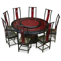 a dining table with six chairs around it and an oval wooden table surrounded by red upholstered chairs