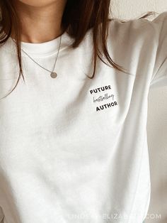 Future Bestselling Author Sweatshirt (Embroidered) | Designed by Lindsay Elizabeth Proclaim your dreams of seeing yourself on the bestsellers list and get inspired to manifest that reality every time you wear this soft, cozy crewneck sweatshirt for writers when writing a book. Gift for writer, Book writing crewneck, NaNoWriMo gift, Gift for author. PRODUCT DETAILS * 50% cotton, 50% polyester * Pre-shrunk * Classic fit * 1x1 athletic rib knit collar with spandex * Air-jet spun yarn with a soft fe Bookish Crew Neck Sweatshirt As A Gift, Embroidered Text, Text Gift, Writer Gifts, Embroidered Gifts, Book Writing, Small Letters, Novel Writing, Embroidered Sweatshirts