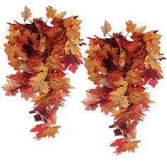 two vases with autumn leaves hanging from them