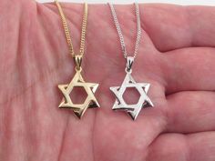 "Fabulous 14k Solid Yellow Gold Jewish Star Of David Pendant Necklace Material: 14k gold , Stamped on the bail and the clasp Star size: 7/8\" long by 5/8\" wide Star pendantweight: 2.1 grams Necklace length and weight: 16\"= 4.7 grams 18\"= 5.0 grams 20\"= 5.9 grams 22\"= 6.4 grams 24\"= 7.0 grams The gourmet chain is 1.5 mm wide and comes with lobster clasp Gift box included  Images may be enlarges to show details.Please pay attention to the photos and read description before the purchase. I ask you earnestly to make sure about measurements such as size , thickness, and length. Should you have any concerns or questions I'll be happy to help you out. I usually respond within a short time. All measurements are approximate.All jewelry is tested for purity and none are plated or filled.Please Gold Sterling Silver Star Of David Necklace, Yellow Gold Star Of David Necklace With Polished Finish, Gold Star Of David Necklace For Anniversary, Silver Star Of David Necklace In 14k Gold, 14k Gold Silver Star Of David Necklace, Classic Star Of David Necklace As Gift, Classic Star Of David Necklace For Gift, Classic Star-shaped Necklace As Gift, Classic Star-shaped Necklace For Gift