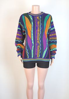 This vintage 90s Rainbow Jumper is in not only super eye catching, snuggly and warm, and incredibly rare and unique, but it is also in amazing vintage condition.  This knit features a beautiful textured rainbow pattern, has cuffed sleeves and is the perfect chunky jumper. Fabric: 100% Australian Merino Wool. Colour: Rainbow. Brand: Kalaroo Australia. Size & Measurements: This knit is a size 16 Australian Womens, or a mens size medium. This jumper also looks incredible when worn oversized. 90s Fitted Crew Neck Sweater, Fitted Crew Neck Sweater 90s Style, Fitted 90s Crew Neck Sweater, 90s Style Knit Sweater For Fall, 90s Style Knitted Crew Neck Sweater, Rainbow Jumper, 90s Jumper, Chunky Jumper, 90s Sweater