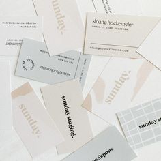 many business cards are stacked on top of each other