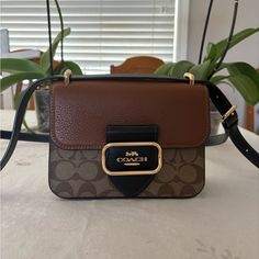 In Excellent Condition - Cross Body Bag But Also A Shoulder Bag - Brand New - No Signs Of Wear - Golden Hardware Square Flap Bag With Branded Hardware For Travel, Brown Square Satchel With Branded Hardware, Designer Brown Crossbody Box Bag, Brown Rectangular Flap Bag With Branded Hardware, Brown Box Bag With Branded Hardware For Daily Use, Brown Box Bag With Branded Hardware For Travel, Brown Rectangular Box Bag With Branded Hardware, Square Bag With Branded Hardware For Everyday Use, Brown Box Bag With Branded Hardware And Top Handle