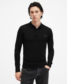 Blend casual and formal styling with the Mode Merino Polo. Made from soft merino wool, it features a three-button placket and our hallmark Ramskull embroidered on the chest. Pub nights or busy days out? Give it a go, it's the perfect base layer for seasonal styling.   This polo is designed to a slim fit Classic collar Ribbed trims Long sleeves Three-button placket Ramskull embroidery Long Sleeve Polo Shirt With Buttons For Work, Fitted Long Sleeve Polo Shirt With Buttons, Fitted Long Sleeve Polo Shirt For Formal Occasions, Allsaints Classic Long Sleeve Top, Fitted Fall Polo Shirt With Button Closure, Casual Merino Wool Polo Shirt For Workwear, Classic Long Sleeve Allsaints Tops, Long Sleeve Polo Shirt, Going Out Outfits