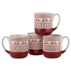 four red and white coffee mugs with reindeer designs on the front, one has a spoon