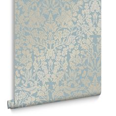 a blue and gold wallpaper with flowers on it