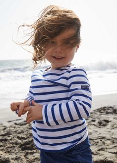 Easy to mix and match, this striped sailor shirt with 3/4 sleeves lends itself to a multitude of styles to brighten a child's day: Blue and white for little sailors, with a tulle skirt for dancing princesses, worn even with the motley colors of a clown costume....the possibilities are endless. For a Grown-Up-&-Me look, coordinates with our best selling MINQUIERS MODERNE. Made in Saint-James, Normandy, France.100% lightweight cotton jersey. White Sailor Style Long Sleeve Tops, Navy Long Sleeve Marine Top, Marine Style Long Sleeve Cotton Tops, White Marine Style Long Sleeve Top, Striped Sailor Long Sleeve Top, Sailor Striped Long Sleeve Top, Sailor Style Striped Long Sleeve Top, Playful Striped Long Sleeve Top, Striped Long Sleeve Playful Top