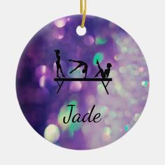 a purple ornament with two women doing yoga on a bench and the words jade