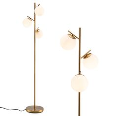 three brass floor lamps with white glass balls on them