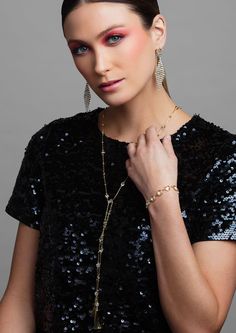 Wrap yourself in sparkle with the LONDON lariat necklace. This versatile necklace will be your go to necklace this season, and can be worn in a variety of ways. Layer it up or wear it in the back — the options are endless. Available in a bright silver or trendy gold, this multi-functional lariat necklace is perfect for any occasion. The necklace is completed with metal tassels at the end to a bit of drama and measures to 36 inches in length allowing you to style it in a variety of ways. Pink Emerald, Black Tie Affair, Black Hot Pink, Lariat Necklace, Luxury Accessories, Diamond Crystal, Crystal Bracelets, Black Tie, Gold And Silver