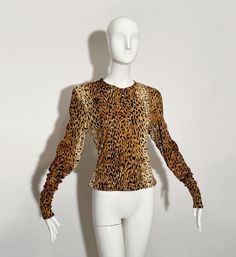 Leopard print blouse. Crew neck. Long sleeves. Polyester.  *Condition--great vintage condition, missing a few stitches at neck seam (as pictured). Not noticeable.  Measurements Taken Laying Flat (inches)-- Shoulder to Shoulder: 18 in. Sleeve Length: 30 in. Bust: 34 in. Length: 22 in. Marked size: Large Vintage Fitted Printed Tops, Fitted Vintage Printed Tops, Vintage Printed Tops For Fall, Stretch Leopard Print Blouse, Fitted Leopard Print Camisole, Dior Skirt, Classy Clothes, Brown Trousers, Leopard Blouse