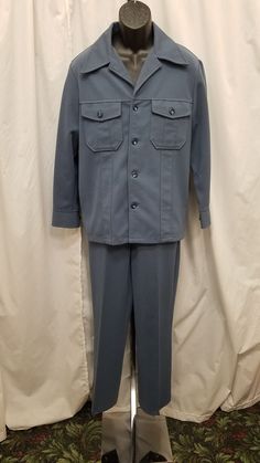 Vintage 70s Haband Paterson, NJ Slate Blue Textured Polyester Western Rancher Leisure Disco 2 Piece Suit, Pockets Buttons, Excellent!  The shirt/jacket has a notched collar, 2 chest pockets, 4 button front closure, 1 button detail on sleeve cuffs, and 2 side vents. The pants have a front hook and eye and zipper closure, belt loops, along with 2 front and 2 back pockets. This suit is in excellent condition, very tiny bit of pilling at top of waist in the back of pants (see pics)! Jacket Measureme Paterson Nj T Shirt, Classic Blue Sets With Pockets, Vintage Blue Long Sleeve Sets, 70s Suit Mens, Paterson Nj, 2 Piece Suit, Leisure Suit, Older Fashion, Wedding Suits Men