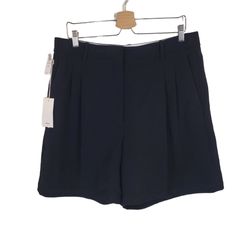 Nwt Wilfred Aritzia Black Effortless 7" Dressy Shorts. Size 16. Double Bar & Hook/Zip Front Closure. Pleated. Front Slash Pocket. Darted Back Waist. Back Welt Pockets. 100% Polyester. Machine Wash Cold Gentle Cycle. Approx. Measurements: 17.75" Waist Flat. 13.5" Rise. 7" Inseam. Fitted Workwear Skort With Short Leg, Elegant Fitted Above Knee Shorts, Elegant Fitted Above-knee Shorts, Fitted Above Knee Summer Bottoms, Chic Stretch Knee-length Shorts, Summer Workwear Skort With Short Leg, High Waist Skort For Summer Workwear, Fitted Bermuda Shorts With Short Inseam For Spring, Summer Workwear Skort With Short Inseam