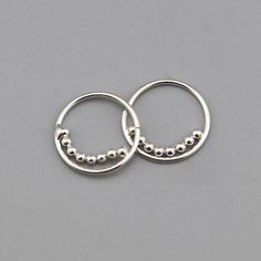 925 Silver Ball Beaded Hoop Nose Ring, Silver Hoop Nose Ring, Silver Beaded Hoop, Sterling Silver Hoop Nose Ring Jewelry, Modern Silver Nose Ring CODE: NSHP159 Material: 925 Sterling Silver Size: 10mm Weight: 0.3 Gram Finishing: Silver Price per Pairs This beautiful pair of 925 Silver Ball Beaded Hoop Nose Ring, Silver Hoop Nose Ring gift box would be a perfect gift for that special someone in your life Buy this nose ring for your loved one or best friend and know that without a doubt you have p Silver Hoop Nose Ring, Hoop Nose Ring, Nose Ring Jewelry, Silver Nose Ring, Nose Rings Hoop, Cz Stud Earrings, Silver Prices, Beaded Hoops, Sterling Silver Hoops