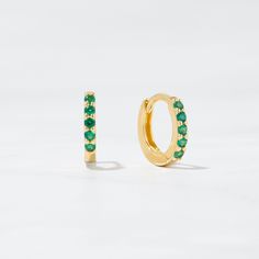 Beautiful, minimalist huggie hoop earrings * Made of 925 Sterling Silver * 14k Gold or Rose Gold Plated (we use a very thick plating, for a piece that will be in your jewelry box for years to come) * Inner Diameter Measures 7 mm * Outer Diameter Measures 9mm * Features 5 Emerald CZ Stones * SOLD as a PAIR! * Snug Fit Also available in Sapphire, Black Spinel, and Ruby CZ Ships same day! Happy to answer any questions! Everyday Green Huggie Earrings, Green Huggie Hoop Earrings For Everyday, Green Huggie Earrings For Everyday Wear, Dainty Green Huggie Hoop Earrings, Minimalist Green Hoop Huggie Earrings, Green Minimalist Small Hoop Huggie Earrings, Minimalist Green Huggie Hoop Earrings, Green Minimalist Huggie Hoop Earrings, Green Hypoallergenic Huggie Earrings For Everyday