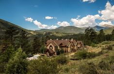 a large house in the middle of mountains