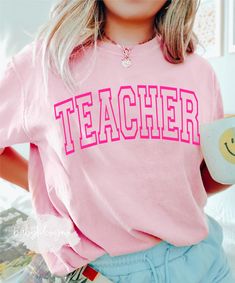 "Teacher Era Shirt, Retro Teacher Tshirt, Oversized, Back To School,Comfort Colors® Trendy Teacher Gift, Teach, Teacher Era, Baggy, First Day 📋 HOW TO ORDER: 1. Select the size 2. Select the color 3. Select the quantity  4. Add personalization if required 5.Add to Cart (\"buy now\" will take you directly to checkout and \"add to cart\" will allow you to continue shopping with us) 6. Submit order (Shipping will automatically be combined for you) Always FREE SHIPPING on orders of $35 or more 👚G Pink College T-shirt With Text Print, Pink T-shirt With Letter Print For Everyday, Oversized School Spirit T-shirt With Letter Print, Oversized Pink Top With Text Print, Pink Relaxed Fit T-shirt For School, Pink Letter Print Tops For College, College Graphic Tee In Pink, Pink Letter Print T-shirt For Everyday, Pink Graphic Tee For College