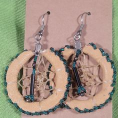 These Native American Dreamcatcher Earrings Are Vintage. Handmade With Leather, Glass Beads, And I Believe Catgut (Intestines). Glass Beads Are Turquoise Green And Black. I Have Put Them On New Cardstock, Rubber Earring Backs, And Archival Sleeve. I'm Not Sure They Were Ever Worn As They Are In Such Nice Condition. These Are An Estate Item From Here In The Southwest. Please Reach Out If You Have Any Questions. We Are A Smoke-Free And Pet Friendly Home. Items Are Cleaned As Able And Stored In Plastic Away From Pets Until They Are Shipped. Thank You Handmade Southwestern Brown Jewelry, Artisan Brown Beaded Nickel-free Earrings, Artisan Brown Beaded Earrings For Pierced Ears, Brown Beaded Southwestern Jewelry, Southwestern Brown Beaded Jewelry, Southwestern Style Brown Beaded Jewelry, Southwestern Style Brown Jewelry For Festivals, Bohemian Brown Beaded Round Earrings, Adjustable Southwestern Brown Earrings