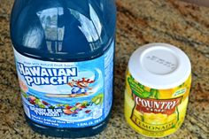 a bottle of hawaiian punch next to a container of yogurt on a counter