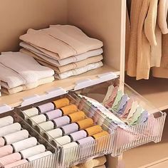 an organized closet with folded clothes and linens