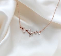 Our delicate rose Gold bridal or bridesmaid necklace is created with Premium European Crystals PLEASE ALLOW APPROX 7-10 BUSINESS DAYS FOR COMPLETION BEFORE SHIPPING.So lovely and simple with a leafy design. Necklace pictured measures 16 inches and extends to 18 inchesPendant measures 1.75" x .5"This is an original design by © Treasures by Agnes FOR MATCHING PIECES SIMPLY TYPE "JOY" IN THE SEARCH BAR Rose Gold Jewellery, Rose Gold Necklace Simple, Crystal Necklace Designs, Gold Bridal Necklace, Crystal Wedding Jewelry, Rose Gold Bridal, Dream Gift, Bridesmaid Necklace, Jewelry Design Necklace