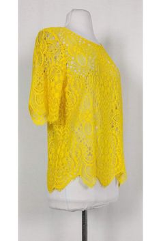 Chic yellow lace top from Trina Turk. Made with a rounded neckline, short sleeve and scalloped edges. Pair it with a tank top and your favorite skinny jeans for a casual day look. Size M Lace fabric Rounded neckline Short sleeves Semi-sheer Scalloped edges on hem & sleeves Bust 39" Waist 38" Shoulder to hem 24" Summer Top With Scalloped Edges For Day Out, Short Sleeve Lace Top For Summer, Summer Scalloped Lace Top, Casual Scalloped Lace Tops, Summer Crochet Top With Scalloped Lace, Fitted Yellow Crochet Top For Spring, Summer Lace Blouse With Crew Neck, Chic Tops With Scalloped Edges For Day Out, Spring Crew Neck Tops With Scalloped Edges