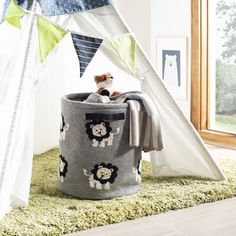 a child's play tent with stuffed animals in it