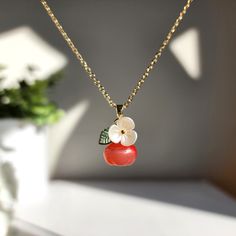 Our cute apple necklace are made with glass apples, acrylic flowers, acrylic leaves and 14k gold plated necklace which are good for delicate ears. We have matching glass apple earrings.Size: the pendant size is about 0.6" wide and 1" long the length is about 18" with 1" extension chain Trendy Flower Shaped Jewelry For Gifts, Red Dangle Jewelry With Fruit Design, Cute Flower Pendant Jewelry For Gifts, Cute Flower Pendant Jewelry Gift, Cute Flower Shaped Jewelry For Gifts, Cute Flower Shaped Jewelry Gift, Cute Flower-shaped Jewelry For Gifts, Red Fruit Design Dangle Jewelry, Trendy Flower Pendant Jewelry Gift