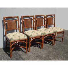 set of four bamboo chairs with upholstered cushions