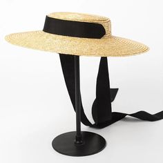 Complete your summer look with our Wide Brim Straw Boater Hat, a timeless accessory for sunny days. Crafted from straw, this boater hat features a wide brim that offers stylish sun protection. Perfect for beach outings or picnics, its classic design adds a touch of vintage charm to any outfit. Casual Straw Hat, Straw Boater Hat, Womens Straw Hats, Straw Boater, Wide Brim Straw Hat, Black And White Ribbon, Floppy Sun Hats, Boho Hat, نظارات شمسية