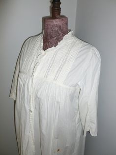 "Beautiful antique Victorian Edwardian nightgown.  This lovely gem is made of a nice white cotton with a very delicate embroidered lace trim and inserts, wonderful handmade pintucks.  It buttons 3/4  of the way down the front. In very nice vintage condition-no holes or stains.  I have not laundered this lovely gem.   The photos just do not capture the true charm of this lovely gem.   Measurements~  Bust~ Arm Pit to Arm Pit 42\" (these measurements are side to side flat across and doubled)   Leng White Cotton Regency Prairie Dress, White Cotton Regency Style Prairie Dress, Classic Cotton Prairie Dress For Daywear, Victorian Cotton Prairie Dress For Daywear, Cotton Victorian Dress For Daywear, Victorian Prairie Dress With Lace Trim In White, Vintage White Victorian Dress With Lace Trim For Daywear, Classic Cotton Victorian Dress For Daywear, Cotton Victorian Cottagecore Dress For Daywear