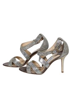 Sparkle and shine in these metallic Jimmy Choo strappy sandal heels! Featuring a glitzy design, they're the perfect match for any beaded cocktail dress or jazz up your skinny jeans with a touch of sparkle and a dazzling handbag! Size 6 (IT 36) Made in Italy Glitter-covered leather upper Strappy design with buckle closure Leather footbed Leather sole Heel 3.5" Cocktail Sandals With Heel Strap For Party Season, Cocktail Party Heel Strap Sandals, Sparkling Sandals For Summer Night Out, Cocktail Party Sandals With Heel Strap, Sparkling Sandals For Night Out In Summer, Glamorous Strappy Sandals For Night Out, Holiday High Heel Sandals, Evening Open Toe Sandals With Sequins, Sequin Open Toe Evening Sandals