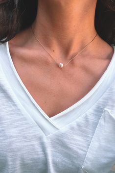 Dainty and minimal, pearl necklace. Designed with the skinniest chain that creates a modern and simple statement. This single necklace is tarnish free and meant to last with the proper love and care. Gold dipped chain and shiny, rounded, pearl. Single Necklace, Love And Care, Gold Dipped, Pearl Necklace, Chain, Gold, White