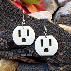 These little Electric Outlet Earrings, inspired by a 3 prong plug socket thingy, always looked like a little face to me. Shocking! 🔌 Outlet pendants are made of off-white laser cut acrylic. 🔌 The Funny and Weird Outlet Face pendants measure about 1" wide and about 1" long and are handmade to your specifications! Pick from: ~ Nickel Free (Shown in Pics) ~ Clip Ons ~ .925 Sterling Silver Hooks 3) ~ Plastic Hooks 🔌 Makes a great gift for your eccentric friends or a treasure to keep. Super charge your style with these unusual, yet lightweight Electric Outlet Face Earrings! Great for everyday wear, these totally rad earrings will get you compliments every time!  -------◆-◆-◆------- Join the ★Email★ List and get a Sign On Bonus Code!  ☛ www.ItsJustSoYou.com Check out my Etsy Shop! E A R R I N Earrings Weird, Weird Earrings, Crazy Earrings, Earring Inspo, Earrings Outfit, Weird Jewelry, Funny Earrings, Quirky Earrings, Funky Earrings