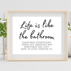 a black and white print with the words life is like the bathroom