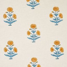 an orange and blue flower pattern on white fabric