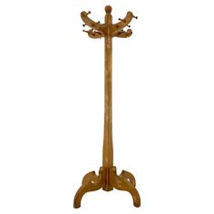 a wooden coat stand with three birds on it's legs and two hooks in the middle