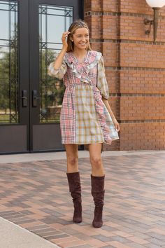 A "Pink and Yellow Plaid Dress" is an adorable fashion choice that radiates charm and playfulness. This delightful dress showcases a playful pattern featuring intersecting horizontal and vertical lines, creating a delightful grid of squares or rectangles. The dominant colors in this dress are the sweet and cheerful hues of pink and yellow, which combine to create an irresistibly cute and lively look.Material: 100%cottonFit: True To Size Our model is wearing a size small Preppy Mini Length Spring Dress, Preppy Mini-length Spring Dress, Preppy Mini Length Dress For Spring, Cute V-neck Dresses For Fall, Spring Preppy Knee-length Dress, Feminine Plaid Spring Dress, Feminine Plaid Summer Dress, Preppy Mini Dress For Spring, Feminine Gingham Dress For Day Out